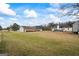 Spacious property with a large yard, featuring multiple buildings and plenty of room for outdoor activities at 3403 Bill Gardner Pkwy, Locust Grove, GA 30248