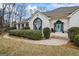 Inviting front exterior with well-maintained landscaping, a blue front door, and classic architectural features at 3403 Bill Gardner Pkwy, Locust Grove, GA 30248