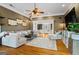 Spacious living room with hardwood floors, comfortable seating, and stylish decor with view into foyer at 3403 Bill Gardner Pkwy, Locust Grove, GA 30248