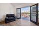 Balcony with city views, an outdoor seating area, and access from living area at 560 John Wesley Dobbs Ne Ave, Atlanta, GA 30312