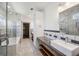 Bright bathroom with glass shower, soaking tub, storage, and double sink at 560 John Wesley Dobbs Ne Ave, Atlanta, GA 30312