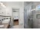 Modern bathroom design showing frameless shower and vanity with an open view to the bedroom at 560 John Wesley Dobbs Ne Ave, Atlanta, GA 30312