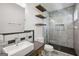 Modern bathroom with glass shower enclosure and stylish fixtures, featuring wood accents at 560 John Wesley Dobbs Ne Ave, Atlanta, GA 30312
