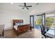 Charming bedroom with a ceiling fan, hardwood floors, and a private deck at 560 John Wesley Dobbs Ne Ave, Atlanta, GA 30312