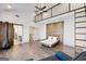 Spacious bedroom with a unique floating bed frame, loft access, and black fireplace at 560 John Wesley Dobbs Ne Ave, Atlanta, GA 30312