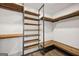 Spacious walk-in closet with custom wood shelving and laminate flooring at 560 John Wesley Dobbs Ne Ave, Atlanta, GA 30312