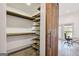 Well-organized closet with barn door and natural wood shelving, offering ample storage at 560 John Wesley Dobbs Ne Ave, Atlanta, GA 30312