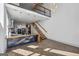 A bright living space with high ceilings, large windows, and a modern open floorplan and floating staircase at 560 John Wesley Dobbs Ne Ave, Atlanta, GA 30312