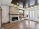 Spacious living room with modern fireplace, wood accent wall, and sliding glass doors at 560 John Wesley Dobbs Ne Ave, Atlanta, GA 30312