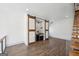 Open loft area showing the wet bar, modern stairs and hardwood style flooring at 560 John Wesley Dobbs Ne Ave, Atlanta, GA 30312