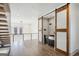Bright and airy loft space featuring a wet bar, modern staircase, and wood-look floors at 560 John Wesley Dobbs Ne Ave, Atlanta, GA 30312