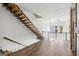 Open concept living area with modern staircase and barn door accent on the wet bar at 560 John Wesley Dobbs Ne Ave, Atlanta, GA 30312