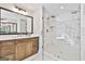 Modern bathroom features a glass-enclosed shower, double vanity, and stylish finishes at 110 Warren Way, Fayetteville, GA 30215