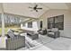 Comfortable covered patio area featuring wicker seating, a ceiling fan, and an outdoor space at 110 Warren Way, Fayetteville, GA 30215