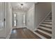 Bright entryway with beautiful hardwood floors and staircase access at 110 Warren Way, Fayetteville, GA 30215