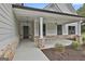 Welcoming front porch with elegant columns and brick accents at 110 Warren Way, Fayetteville, GA 30215