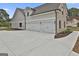 Spacious three-car garage with a long concrete driveway offering ample parking at 110 Warren Way, Fayetteville, GA 30215