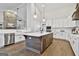 Well-appointed kitchen with a large island, stainless steel appliances, and custom cabinetry at 110 Warren Way, Fayetteville, GA 30215