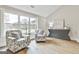 Cozy sitting room with natural light, comfortable chairs, and stylish decor at 110 Warren Way, Fayetteville, GA 30215