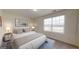 Inviting bedroom with a comfortable bed, bedside tables, and ample natural light at 7728 Sudbury Cir, Covington, GA 30014