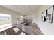 Open-concept kitchen and dining area with hardwood floors and stainless steel appliances at 7728 Sudbury Cir, Covington, GA 30014