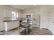 Modern kitchen featuring white cabinets, granite countertops, and stainless steel appliances at 7728 Sudbury Cir, Covington, GA 30014
