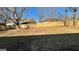 Spacious backyard surrounded by a new wooden fence and mature trees at 95 Grove Creek Dr, Locust Grove, GA 30248