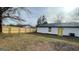 Backyard showing new fencing surrounding the perimeter of the property with a white house at 95 Grove Creek Dr, Locust Grove, GA 30248