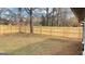 Backyard featuring a newly constructed privacy fence enclosing the property, with the home partially visible at 95 Grove Creek Dr, Locust Grove, GA 30248