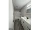Bathroom showcasing a sleek vanity with modern fixtures and a combined shower-tub at 95 Grove Creek Dr, Locust Grove, GA 30248