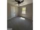 Neutral bedroom with new carpet, a window, and a modern ceiling fan at 95 Grove Creek Dr, Locust Grove, GA 30248