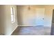 Bright kitchen nook featuring modern flooring, a window, and a contemporary light fixture at 95 Grove Creek Dr, Locust Grove, GA 30248