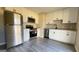 A well-lit kitchen featuring stainless steel appliances and granite countertops at 95 Grove Creek Dr, Locust Grove, GA 30248