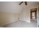 Comfortable bedroom with neutral carpet, angled ceiling, and natural light at 6360 Brookline Ct, Cumming, GA 30040