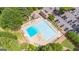 Aerial view of the community pool, surrounded by lounge chairs and ample parking at 6360 Brookline Ct, Cumming, GA 30040