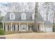 Charming home featuring a porch and a stone foundation at 6360 Brookline Ct, Cumming, GA 30040