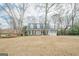 Charming home with multiple windows, a porch and a well-manicured lawn at 6360 Brookline Ct, Cumming, GA 30040