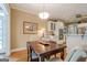 Open concept kitchen, including a breakfast nook table and ample cabinetry for storage at 6360 Brookline Ct, Cumming, GA 30040