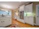 Well-lit kitchen featuring white cabinetry, stainless steel appliances and plenty of storage at 6360 Brookline Ct, Cumming, GA 30040