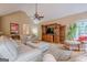 Spacious living room with hardwood floors, comfortable seating, and a large entertainment center at 6360 Brookline Ct, Cumming, GA 30040