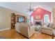 Cozy living room with fireplace, hardwood floors, and comfortable seating perfect for relaxation at 6360 Brookline Ct, Cumming, GA 30040