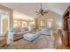 Cozy living room with plush seating, hardwood floors, and an open layout at 6360 Brookline Ct, Cumming, GA 30040