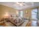 Cozy bedroom with tray ceilings, hardwood floors and natural light at 6360 Brookline Ct, Cumming, GA 30040