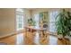 Bright office space with hardwood floors, multiple windows, and a large wooden desk at 6360 Brookline Ct, Cumming, GA 30040