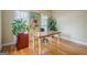 Cozy office featuring a wooden desk, hardwood floors and natural lighting from the windows at 6360 Brookline Ct, Cumming, GA 30040