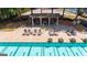 Aerial view of a community pool with lounge chairs and covered seating at 6360 Brookline Ct, Cumming, GA 30040