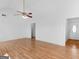 Bright living room with hardwood flooring and an open layout to the kitchen at 150 Grove Creek Dr, Locust Grove, GA 30248
