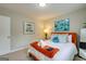 Cozy bedroom features a comfortable bed with decorative pillows, artwork, and soft lighting at 317 Lucan Way, Riverdale, GA 30274