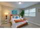Comfortable bedroom with a bedside table and natural light at 317 Lucan Way, Riverdale, GA 30274