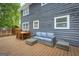 Outdoor deck with comfortable seating and dining area, perfect for relaxation and entertaining at 317 Lucan Way, Riverdale, GA 30274